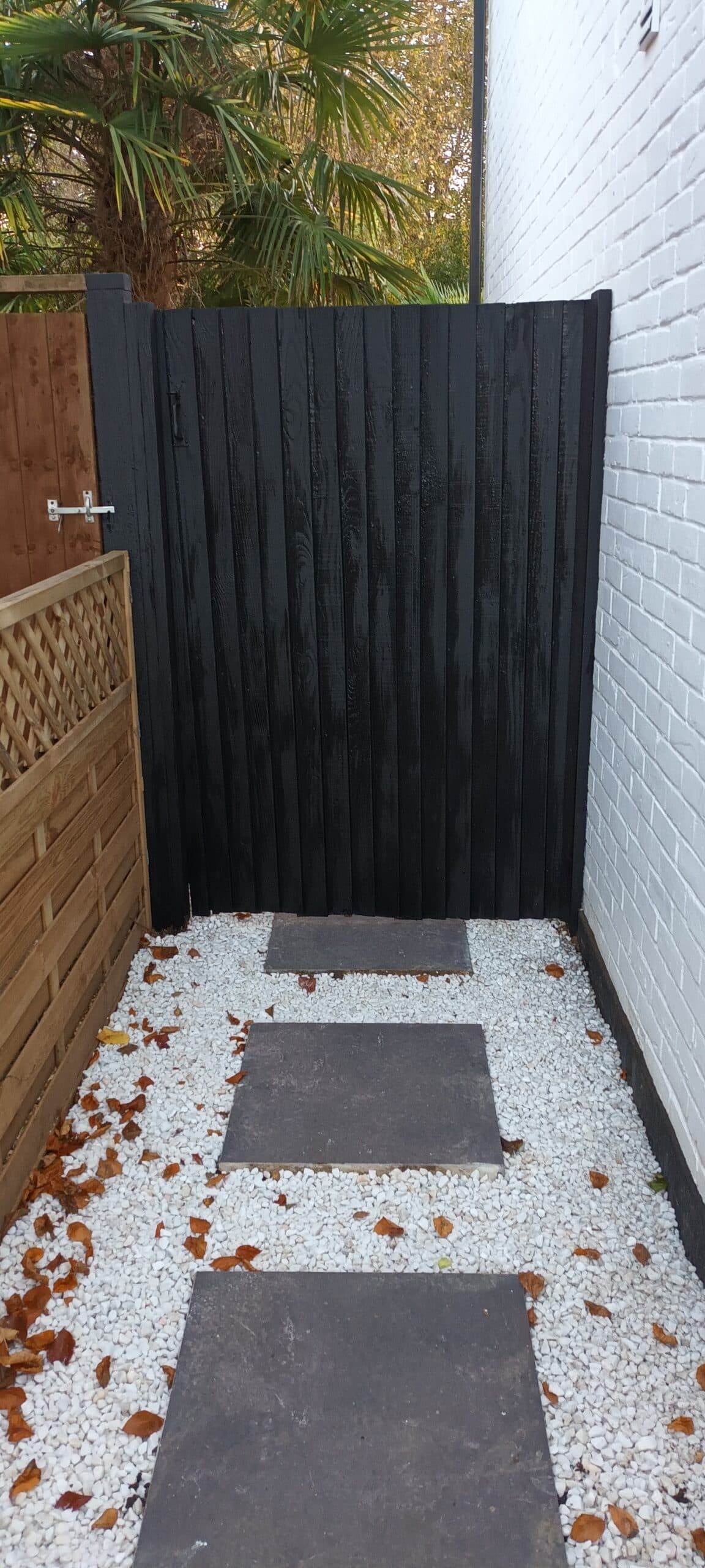 Garden makeover with a new gate, painted fence and paved path by HandyMack