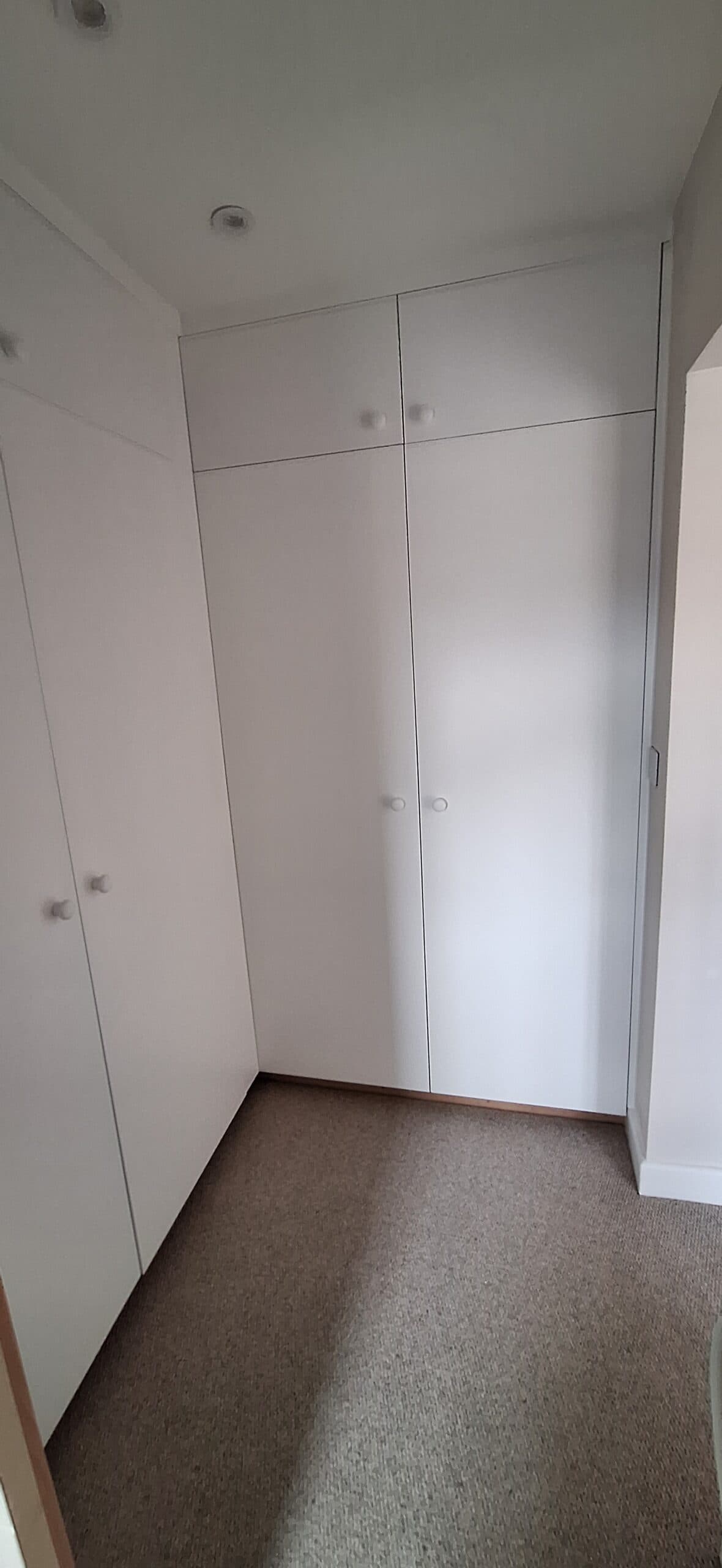 Fitted white wardrobes assembled and installed by HandyMack